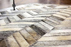 Chevron Pattern Faux Cowhide Area Rug | Non-Slip Leather Carpet for Living Room, Bedroom, and Office | Modern Designer Rug for Home Décor(2.5x8 ft_Grey)