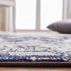 SAFAVIEH Monaco Collection Area Rug - 8' x 10', Ivory & Navy, Boho Chic Medallion Distressed Design, Non-Shedding & Easy Care, Ideal for High Traffic Areas in Living Room, Bedroom (MNC243C)