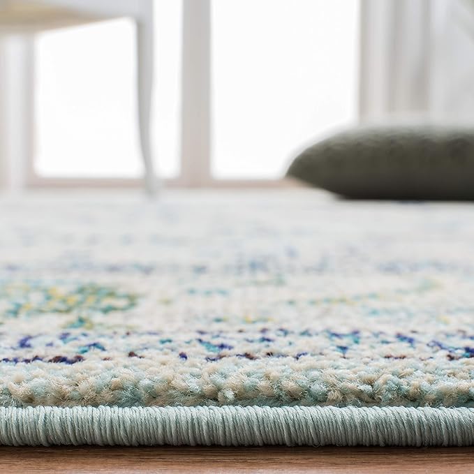 SAFAVIEH Monaco Collection Area Rug - 6'7" x 9'2", Light Blue & Ivory, Boho Chic Medallion Distressed Design, Non-Shedding & Easy Care, Ideal for High Traffic Areas in Living Room, Bedroom (MNC243K)