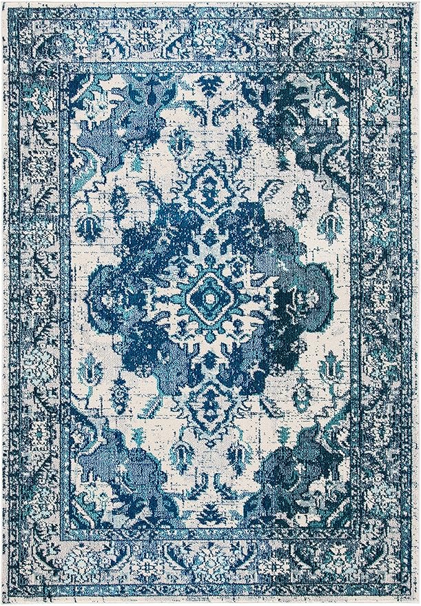 SAFAVIEH Monaco Collection Area Rug - 6'7" x 9'2", Ivory & Blue, Boho Chic Medallion Distressed Design, Non-Shedding & Easy Care, Ideal for High Traffic Areas in Living Room, Bedroom (MNC243A)